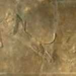 ライオン狩り　盾で身を守りながら、飛び掛ってくるライオンに矢を放とうとしている